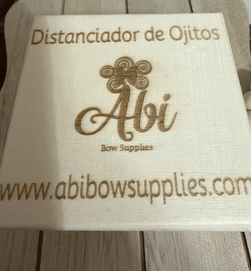Distanciador y Marcadores de Ojitos Abi